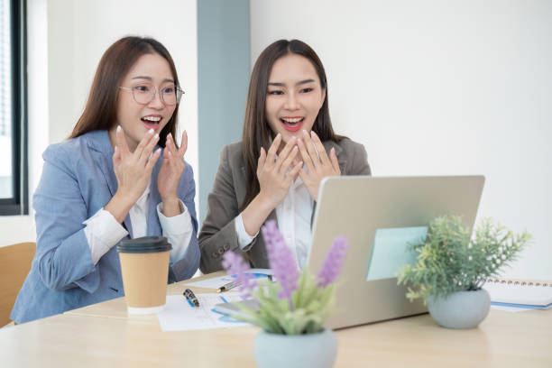 istock Two Female Accountant Collaborating on Financial Graphs and Data Analysis in a Modern Office Setting 2159493435
