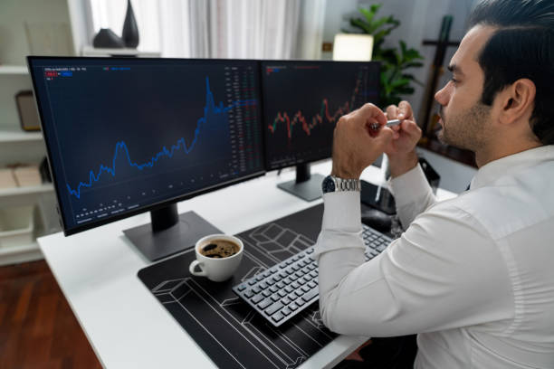 istock Trader analyzing in dynamic stock exchange investment screen on pc. Surmise. 2159498919