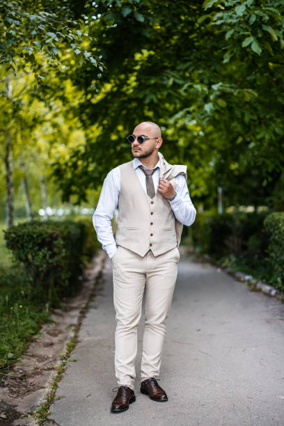 Waiter with long whitish hair on the standby