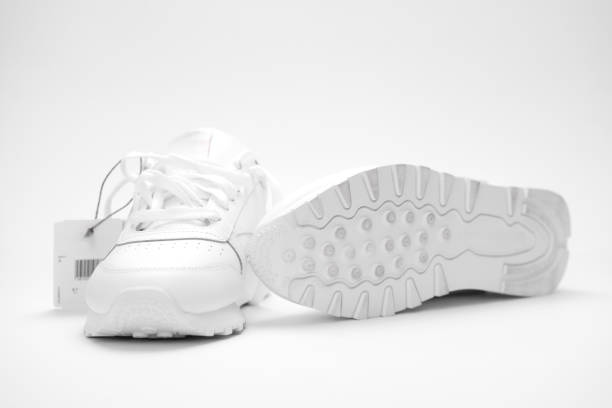 istock New white sneakers on a white background. 2159501010