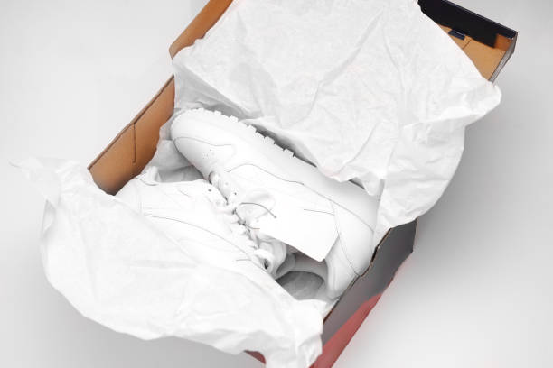 istock New white sneakers in the box on a white background. 2159501353