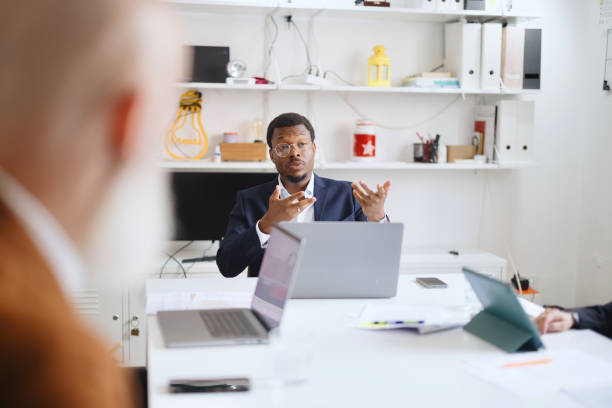 Modern man leading a business meeting