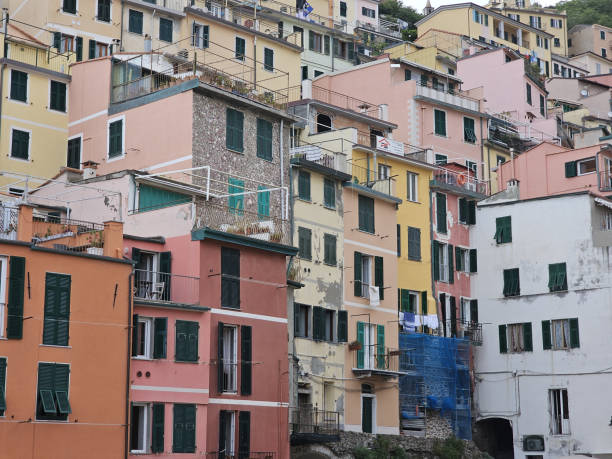 Colorful houses in Riomaggiore filling the whole photo frame. Vertical photo.