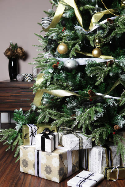 istock gifts and presents under a beautiful christmas tree 2159502872