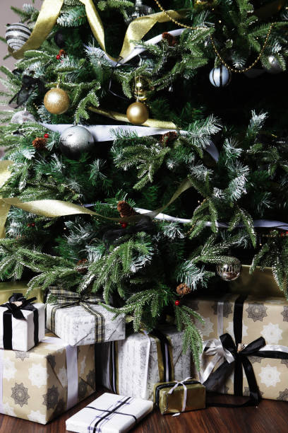 istock gifts and presents under a beautiful christmas tree 2159502884