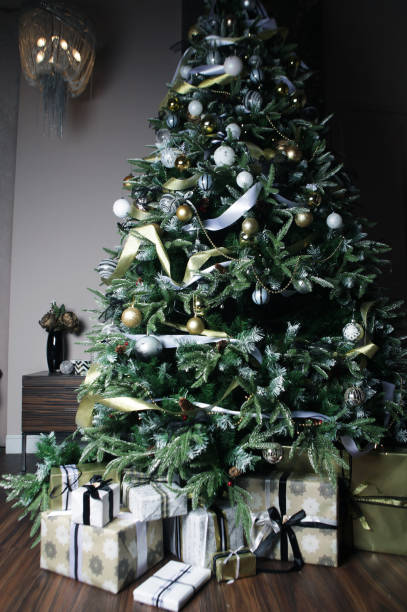 istock gifts and presents under a beautiful christmas tree 2159502885