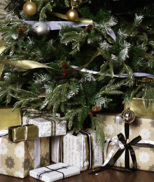 istock gifts and presents under a beautiful christmas tree 2159502898