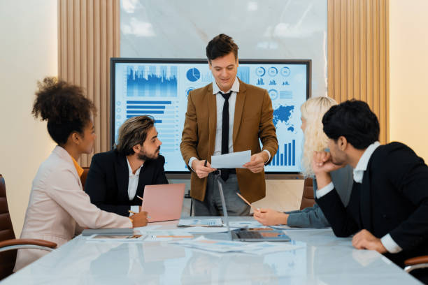 istock Professional smart business team discussion about start up project. Ornamented. 2159504571