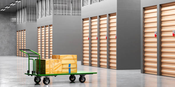 istock Storage company interior. Corridors with doors in Storage Units. Trolley with boxes is wrapped with adhesive tape. Warehouse rental company. Storage Units territory without anyone. 3d rendering. 2159505966