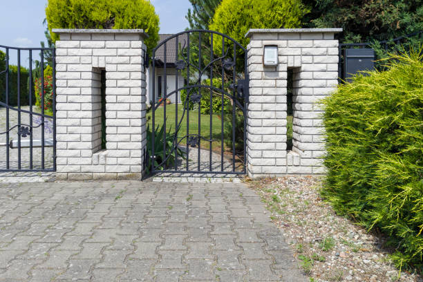 istock Brick Gate with Wrought Iron Fence 2159505981