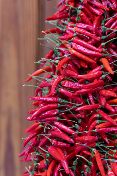istock Bundled red chilli peppers at the market 2159506803