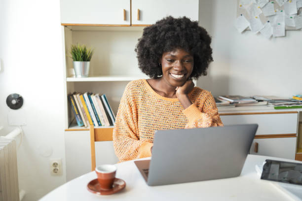 istock Happy female freelancer working on laptop in home office 2159507217