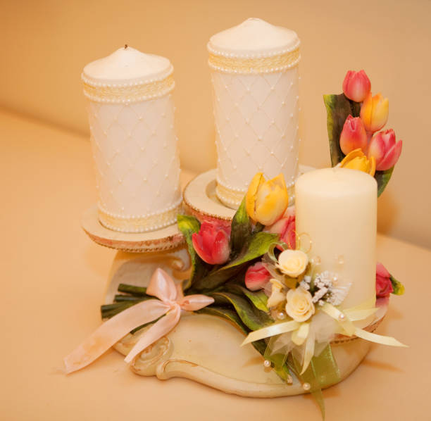 Candles with flower on golden background