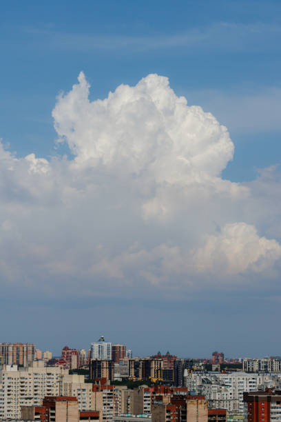 istock white thunderclouds in blue sky. summer cumulus clouds before rain. Beautiful view of nature 2159511608