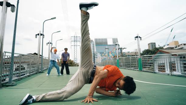 istock Young happy hipster perform break dancing or foot step with friend. Sprightly. 2159511752