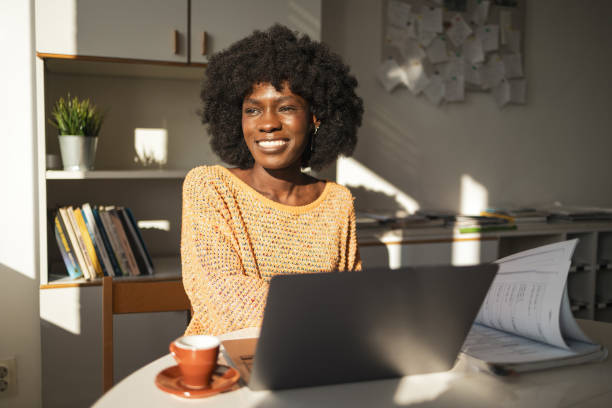 istock Thoughtful female freelancer sitting with laptop and documents in home office 2159511842
