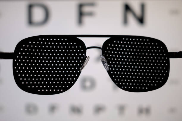 istock Medical training pinhole glasses with eye exam chart on the background 2159512597