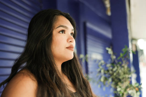 istock Young Asian woman away camera 2159513319