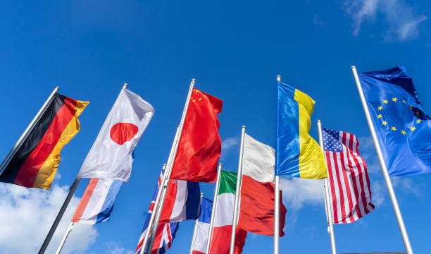 Germany, Trier, June 15, 2024 - Low angle view of international flags against sky
