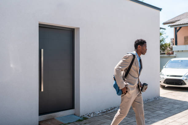 istock Professional Black Businessman Departing for Work with Essentials 2159515028
