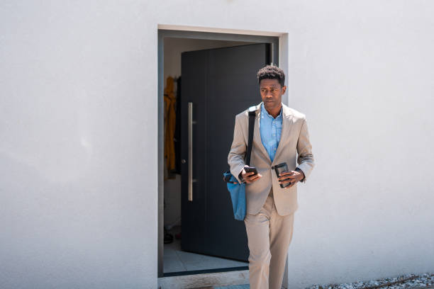 istock Professional Black Businessman Exiting Home Ready for Work 2159515033