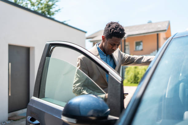 istock Professional Black Man Entering His Car for Work 2159515091