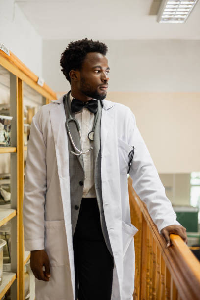 istock Confident Afro-American Medical Student in Lab Coat with Stethoscope 2159515249