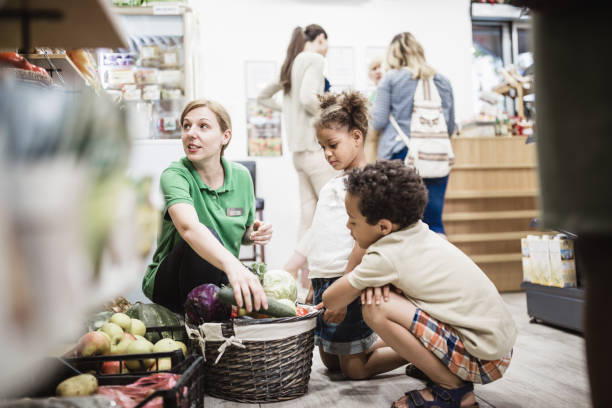 istock Friendly Grocery Store Interaction with Kids During Daytime 2159516372