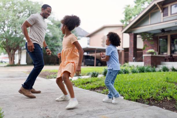 istock Father playing tag game with his little kids 2159518105