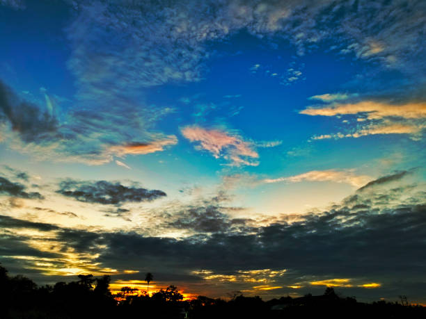 The sky is overcast with dark gray clouds.  Morning atmosphere.  The sun began to shine with soft sunlight.