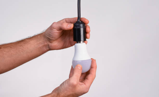 istock replacing the lamp with lamps. 2159522360
