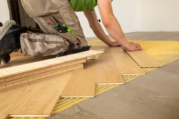 istock Craftsman laying herringbone parquet flooring professionally 2159522944