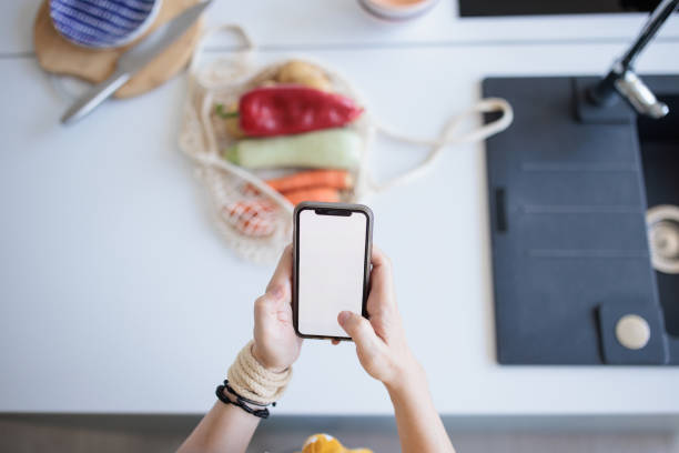 istock Woman using a phone at home 2159526282