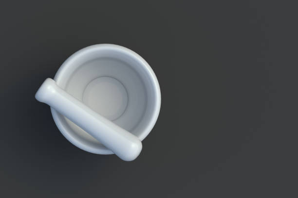 One mortar and pestle on black background. Kitchen utensil. Pharmacy equipment. Tool for grinding ingredients. Top view. Copy space. 3d render