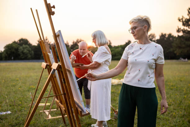 istock Friends painting outdoors in nature 2159529315
