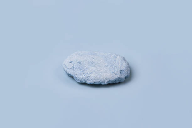istock Stone podium for show cosmetics product presentation. Abstract minimal backdrop. One rock form. Light Blue Studio Background. Scene. Showcase display case. 3D Front View. Trendy neutral color. Space 2159529414
