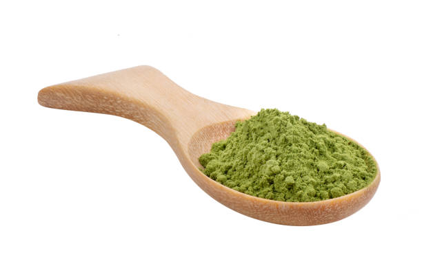 istock matcha green tea powder in wood spoon on white background 2159529525
