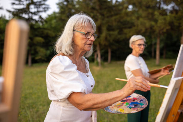 istock Friends painting outdoors in nature 2159530330
