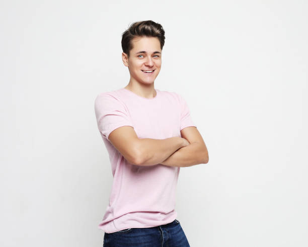 istock young handsome man, wearing pink shirt. 2159530672