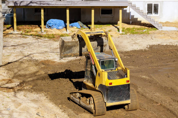 istock An earthmoving tractor is leveling ground at a construction site for cleaning backyard 2159537386