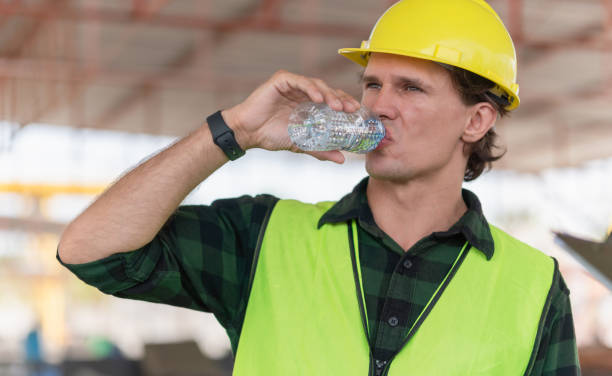 istock Man drinking water at the precast factory site, Engineer man drinking water at construction site 2159539986