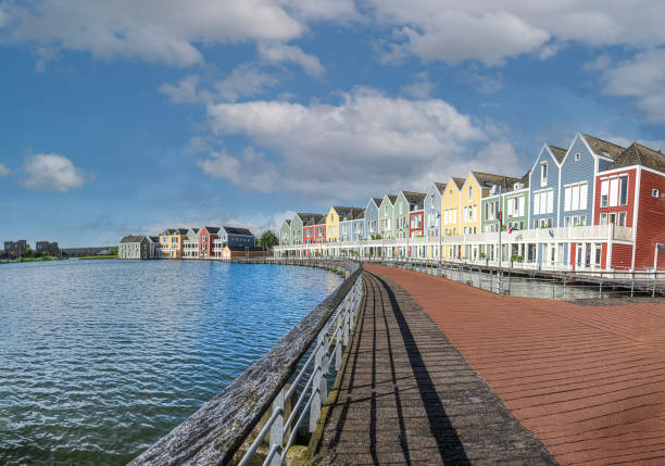 The Rainbow Houses, in the Netherlands are a popular attraction, especially noted for their vibrant and colorful appearance. These houses are located in the town of Houten, near Utrecht. The distinct and charming row of houses, painted in a variety of bright colors, creates a picturesque and photogenic scene that attracts both locals and tourists