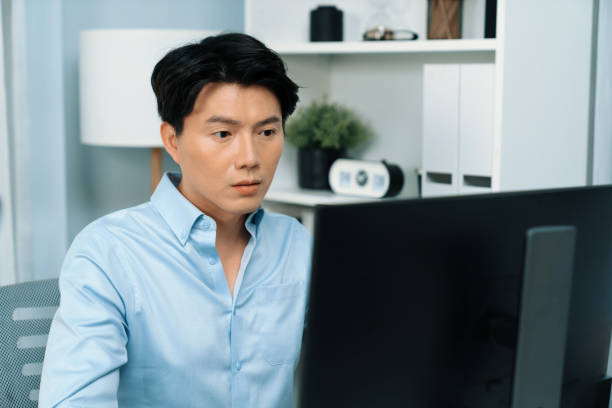 istock Serious smart businessman working computer to check email at office. Infobahn. 2159541807