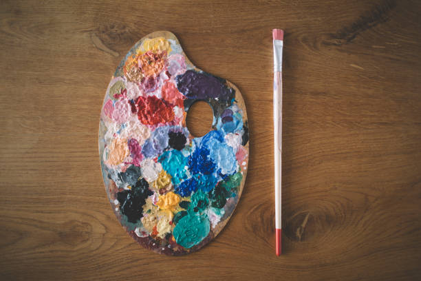 istock Artist's palette and paintbrush 2159542973