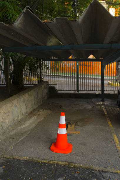 View of red traffic cone in a suburb of Caracas city