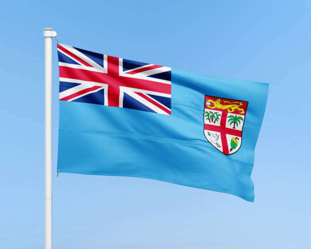 istock Fiji flag on stick on sky background 2159544520