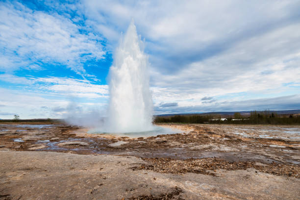 istock Strokkur geyser erupting in Iceland under a vibrant blue sky. 2159545552