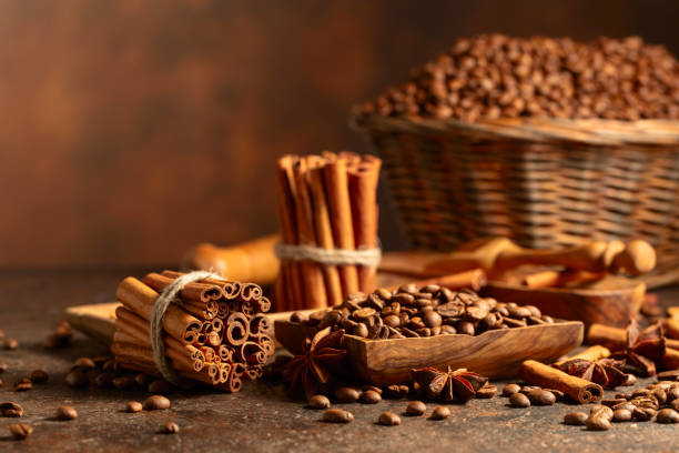 istock Coffee beans with spices on a brown vintage background. 2159545716