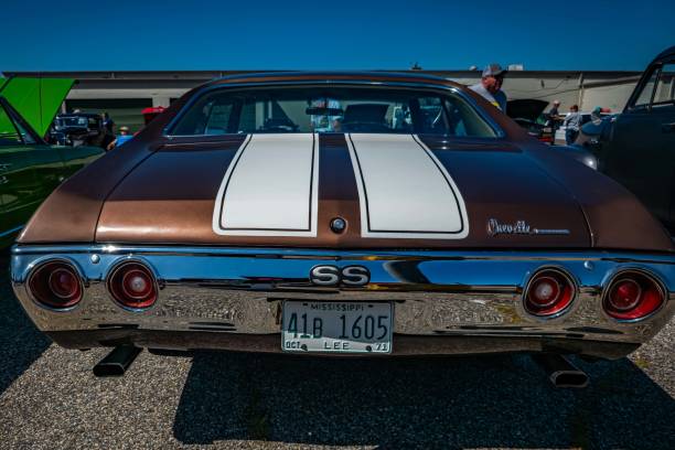 Osona, Spain – June 14, 2025: A rear view of a classic blue 1960s Chevrolet Chevelle Malibu, highlighting its clean lines, chrome bumper, and distinctive tail lights.