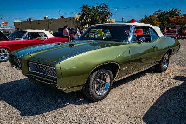 Gulfport, MS - October 01, 2023: High perspective front corner view of a 1968 Pontiac GTO Convertible at a local car show.